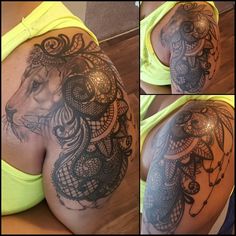 the back of a woman's shoulder with tattoos on it