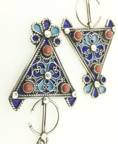 This is a pair of great SILVER, ENAMEL & CORAL EARRINGS from Morocco.  Each earring measures just under 3 1/4" (8,2 cm) long and just over 1 1/4" (3,35 cm) wide.  The earrings feature fantastic wirework with cobalt and sky blue enamel and genuine coral cabochons.  The earwires are slightly thicker than regular Western-sized earwires, but they should fit most people.  These earrings are individually hand made and slight variations in workmanship and enamel are normal.  They weight approximately j Traditional Blue Filigree Earrings, Blue Pierced Earrings For Festival, Coral Earrings, Enamel Earrings, Wire Work, Silver Enamel, Cobalt, Jewelry Earrings Dangle, Two Tone