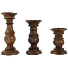 three wooden candlesticks sitting next to each other