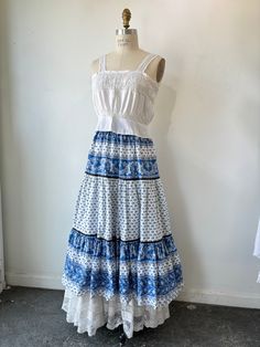 Vintage French Provençal maxi skirt with intricate blue and white pattern Easy to style breezy 100% cotton skirt with French design. Made in France by the brand Solymod. Pairs perfectly with a white blouse (shown with Victorian singlet blouse - also available in the shop) Best fits xs-medium Can fit up to size medium Waist: 24” - 30” In perfect condition with no wear Vintage Cotton Maxi Skirt, Vintage Ruffled Maxi Skirt, Light Blue Long Bohemian Skirt, Non-stretch Blue Maxi Skirt, Non-stretch Bohemian Blue Maxi Skirt, Blue And White Pattern, Ryan Roche, Ace And Jig, Christian Wijnants