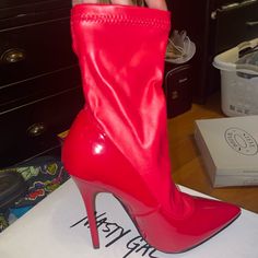 Brand New Never Worn Comes In Box Red Ankle-high Evening Heels, Red Fitted Synthetic Boots, Red Synthetic Boots, Fitted Red Synthetic Boots, Red Ankle-high Heels For Night Out, Stretch Round Toe Party Boots, Red High Ankle Heels For Party, Fitted Boots With Red Sole For Night Out, Red Ankle-high Heels