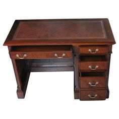 a wooden desk with two drawers on it