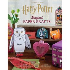 the cover of harry potter's paper crafts book, featuring owls and other items