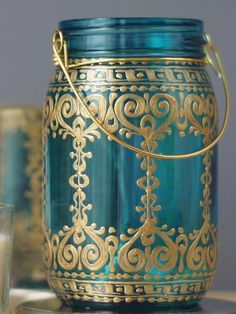 a blue glass jar sitting on top of a table