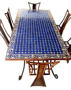 a table with chairs and a blue tile top