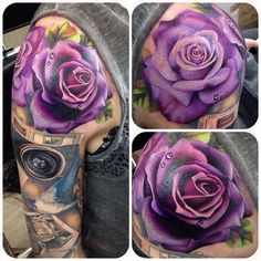 a purple rose tattoo on the left arm and half sleeve, with other tattoos around it