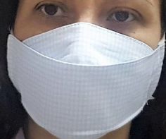 a woman wearing a face mask to protect herself from the sun and cold weathers