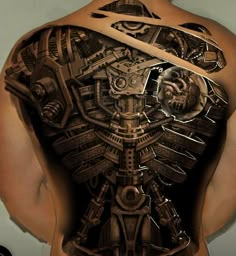 the back of a man's body with mechanical tattoos on it