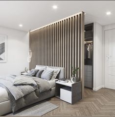 a large bed sitting next to a wooden wall in a bedroom on top of a hard wood floor