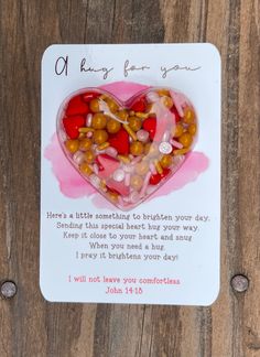 a card with a heart made out of nuts and candy on it that says, oh kiss for you here's a little something to brighten your day