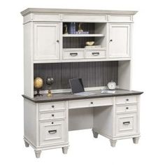 a white desk with drawers and a laptop on it