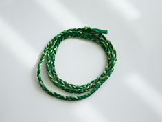 Shades of green combine in this friendship bracelet perfect for spring or summer!  The soft, high-quality cotton used is lightweight and colorfast so you can wear it non-stop, even to the shower or pool, and its a perfect choice for people with metal allergies. Green Braided Bohemian Jewelry, Green Adjustable Cord Bracelets For Beach, Green Adjustable Cord Beach Bracelet, Green Casual Bracelet With Adjustable Cord, Green Casual Bracelets With Adjustable Cord, Casual Green Friendship Bracelets With Adjustable Cord, Casual Green Friendship Bracelet With Adjustable Cord, Bohemian Green Braided Bracelets, Green Bohemian Braided Bracelet