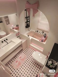 this bathroom has pink and white decor on the walls