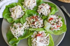 several lettuce leaves with crab salad on them