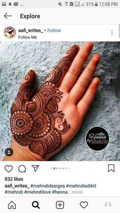 a hand with henna on it and the words explore written in arabic above it