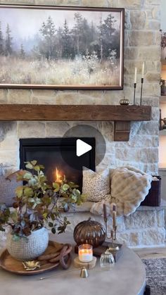 a living room filled with furniture and a fire place in front of a painting on the wall