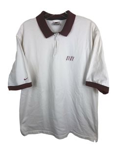 White Collared Shirt For College, Sporty Collared Shirt For Streetwear, Classic White Tops For College, Vintage Nike Cotton Tops, Nike Cotton Short Sleeve Polo Shirt, Casual Nike Cotton Polo Shirt, Nike Cotton Collared Tops, Nike Retro Short Sleeve Top, Nike Classic Collared Tops