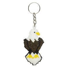 a beaded keychain with an eagle on it's back and yellow feet