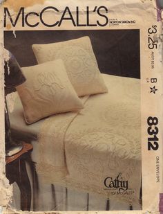 an advertisement for the cover of a bed with two pillows and one pillow on it