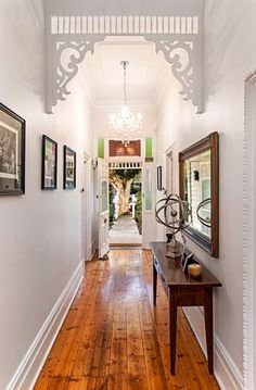 the hallway is clean and ready for us to use as an entrance way in this home