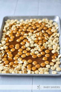 a pan filled with peanut butter and marshmallows on top of a table