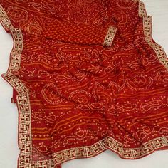 Red color saree is made from chiffon is highlighted with beautiful foil printed with printed with embroidered border work as shown. Comes along unstitched embroidered banglori silk blouse piece which you can customise as per your design/style. Occasion - You can wear this saree for festive and functions. Note:- The actual product may differ slightly in color and design from the one illustrated in the images when compared with computer or mobile screen. Measurements: Saree : Chiffon : 5.5 Mtrs Blouse : Chiffon : 0.8 Mtr Material: Chiffon Stitch Type: Unstitched Country of Origin: India Care Guide: Dry Clean Red Color Saree, Saree Chiffon, Blouse Chiffon, Embroidered Border, Mobile Screen, Chiffon Saree, Foil Print, Blouse Piece, Surprise Gifts