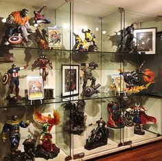 a display case filled with lots of action figures