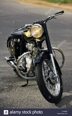 a black and gold motorcycle parked on the street