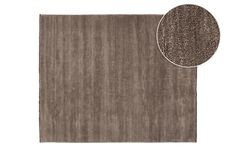 a brown rug with a white background and a round area rug in the middle, next to it