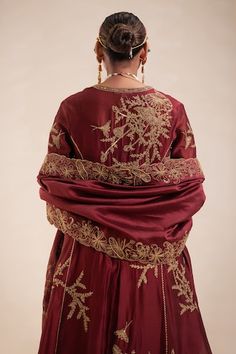 Maroon chanderi kurta with all over gold tone floral embroidery using cutdana, sequins. Paired with a pant and dupatta with embroidered border. - Aza Fashions Traditional Wear With Floral Embroidery In Brocade For Reception, Brocade Sets With Floral Embroidery For Reception, Anarkali Set In Raw Silk With Gold Embroidery, Anarkali Set With Gold Embroidery In Raw Silk, Festive Raw Silk Dupatta With Gold Embroidery, Silk Dupatta With Gold Embroidery For Eid, Festive Gold Embroidered Raw Silk Dupatta, Traditional Silk Anarkali Set With Gold Embroidery, Gold Embroidered Raw Silk Fabric For Reception