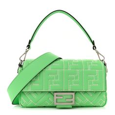 This is an authentic FENDI Nappa Stitched FF 1974 Embossed Baguette in Edamame. This bag is crafted of smooth embossed calfskin leather in green with topstiching. This shoulder bag features a top handle, a long shoulder strap both in smooth calfskin leather and gold hardware. The front flap opens to a black fabric interior with a zipper pocket. Fendi Baguette, Edamame, Black Fabric, Baguette, Gold Hardware, Top Handle, Zipper Pocket, Calf Skin, Fendi