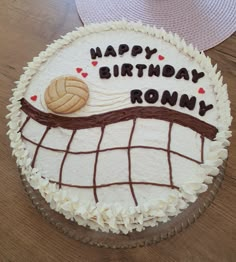 a birthday cake with a volleyball net and ball on the top it says happy birthday ronny