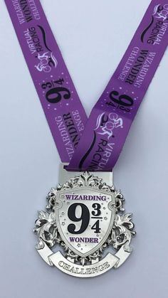 a purple ribbon with the number nine on it is attached to a medal that reads, celebrating 29 years wonder