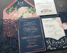 the wedding stationery is laid out on top of each other, including an ornate laser cut card and matching pocketfold