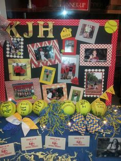 a table topped with pictures and balls covered in confetti