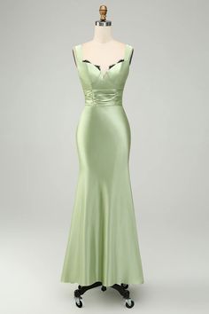 a light green dress on a mannequin