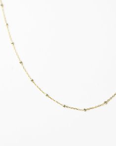 Two Tone Satellite Necklace. ﻿Such a simple minimal design makes it perfect for everyday wear and ideal for layering. Sterling silver beaded on a Gold filled chain Size: 16", 18" Minimalist Station Necklace With Satellite Chain As A Gift, Minimalist Station Necklace With Satellite Chain For Gift, Minimalist Long Necklace With Satellite Chain, Minimalist Satellite Chain Necklace For Layering, Delicate Satellite Chain Necklace For Everyday, Dainty Everyday Necklace With Satellite Chain, Everyday Dainty Necklace With Satellite Chain, Dainty Everyday Necklace With Beaded Chain, Dainty Satellite Chain Necklace