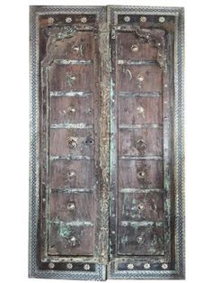 an old wooden door with ornate carvings on it