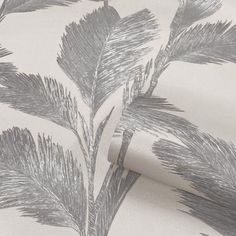 a close up view of a wallpaper with grey and white leaves on the background