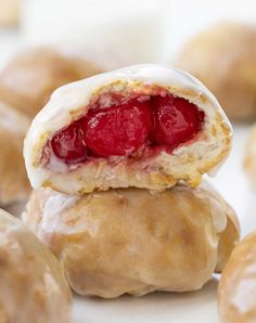 a close up of some doughnuts with jelly inside