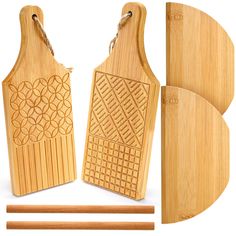 two wooden cutting boards and chopsticks on a white background with the same design