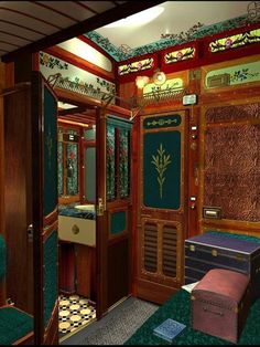 the interior of a train car with green carpeting and stained glass windows on each side