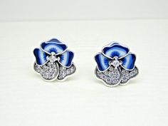 You are purchasing a brand new authentic PANDORA Sterling Silver Blue Pansy Flower Stud Earrings with Clear CZ Item #290781C01 No Further Discounts Apply Blue Pansy Flower, Pansy Earrings, Earrings Pandora, Blue Pansy, Pansy Flower, Pansies Flowers, Flower Stud Earrings, Flower Stud, Flower Earrings Studs