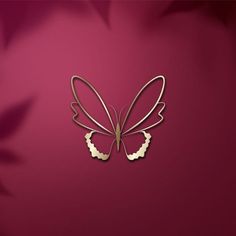 a pair of butterfly shaped hair clips on a pink background