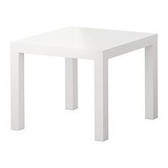 a white square table sitting on top of a white floor