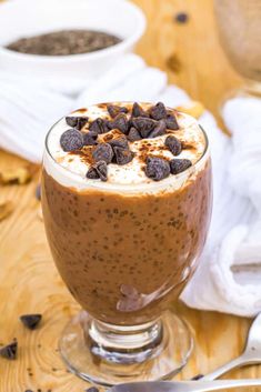 a dessert in a glass with chocolate chips on top