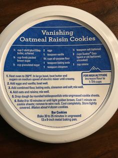 the label for vanishing oatmeal raisin cookies sits on a wooden surface