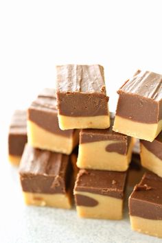 peanut butter chocolate fudge bars stacked on top of each other with text overlay