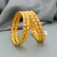 Discover the allure of Handmade Gold Jewelry at https://morvijewels.etsy.com/   Get a dazzling 25% off on all our 22k and 18k gold pieces. Don't miss out on this limited-time offer. Shop now and embrace the radiance of gold! Beautiful yellow gold handmade bangle bracelet, vintage design jewelry Metal - real Yellow Gold  Gold Purity- 22 karat yellow Gold Length- 6.3 cm inner diameter all size are available Width - 0.6 cm Weight - 22.12 grams approx (4 pcs ) Click here  https://morvijewels.etsy.com/    to get more discount and offers Happy to take wholesale bulk orders. Yellow Gold Plated Bracelets For Wedding, Yellow Gold-plated Bracelets For Wedding, Yellow Intricate Design Bracelets For Wedding, Diwali Yellow Gold Bangle, Diwali Yellow Gold Bangle Jewelry, Yellow Gold Bangle For Diwali, Gold Bracelets With Intricate Design For Marriage, Gold Bracelets With Detailed Design For Marriage, 22k Gold Bracelet For Diwali