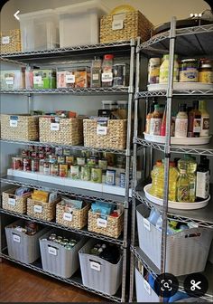 an organized pantry with lots of food and storage bins on the bottom shelf, along with baskets